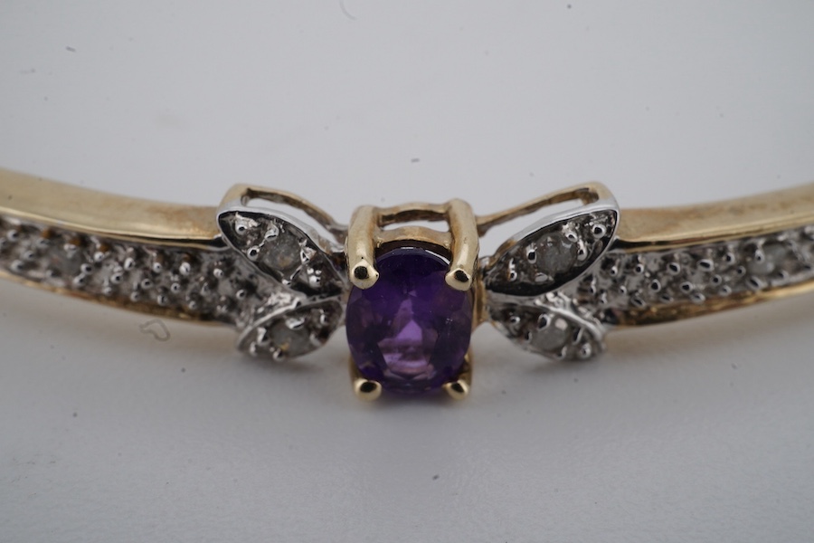 An amethyst and diamond bangle, inner circumference 17.5cm, mounted in gold, gross weight 7 grams; and an Edwardian bar brooch designed as an insect, set with a circular-cut aquamarine and seed pearls, mounted in gold, l